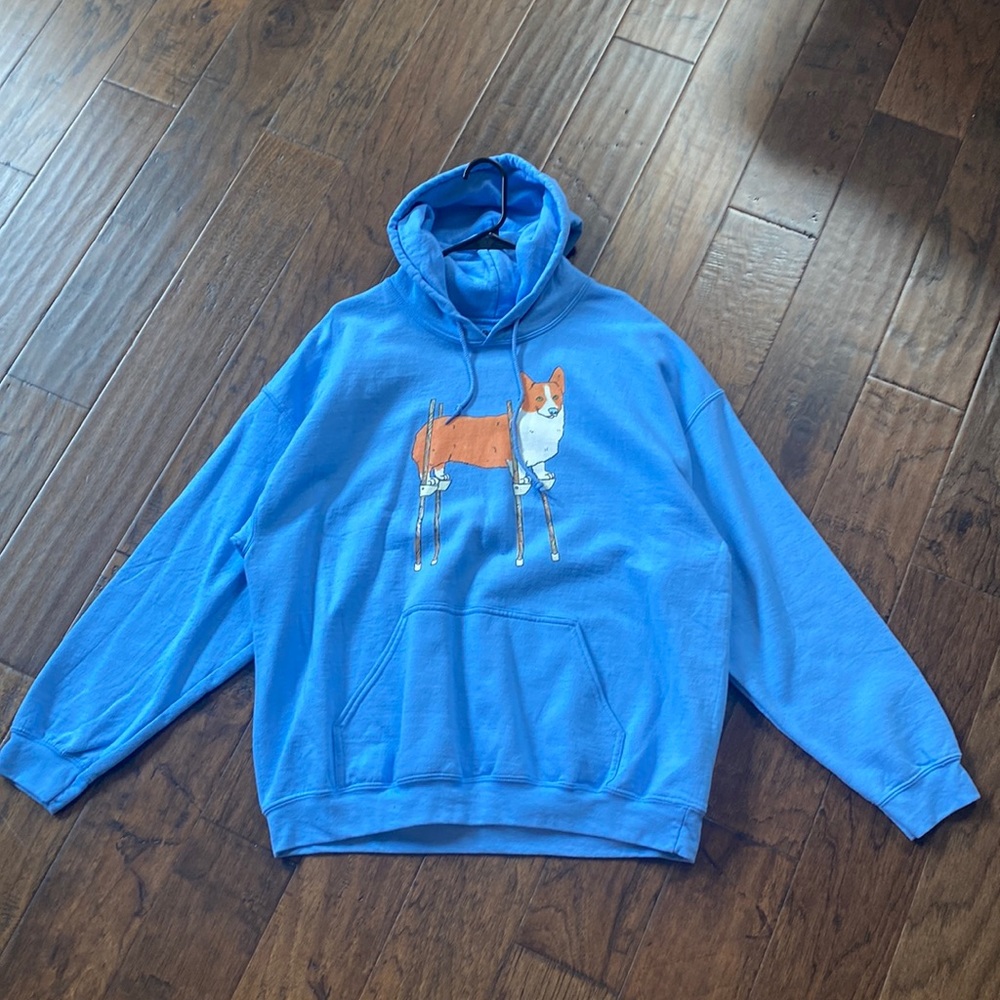 Size Large Black Matter Blue Hoodie with Corgi on Stilts graphic